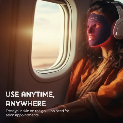 Person wearingkViva Glam photon LED Face Therapy Mask and headphones on an airplane with text promoting skincare product use.